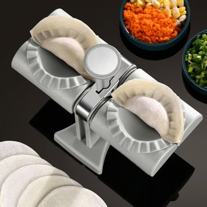 Double Head Dumpling Maker ~ Seal two perfect dumplings in one press.